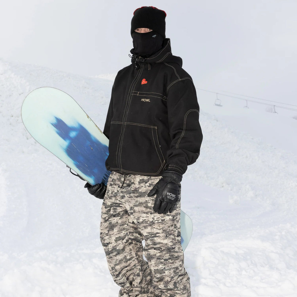 Howl Nowhere Pant in Camo on snow